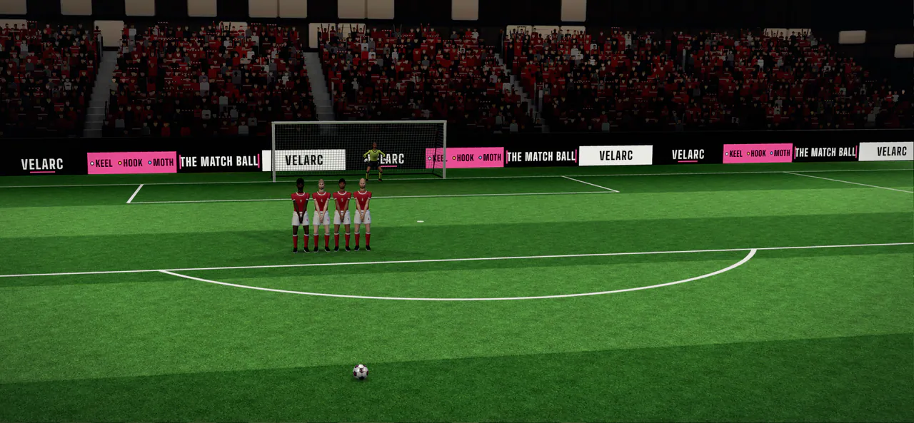 The free-kick spot under the floodlights, the wall and the keeper in front of the goal.