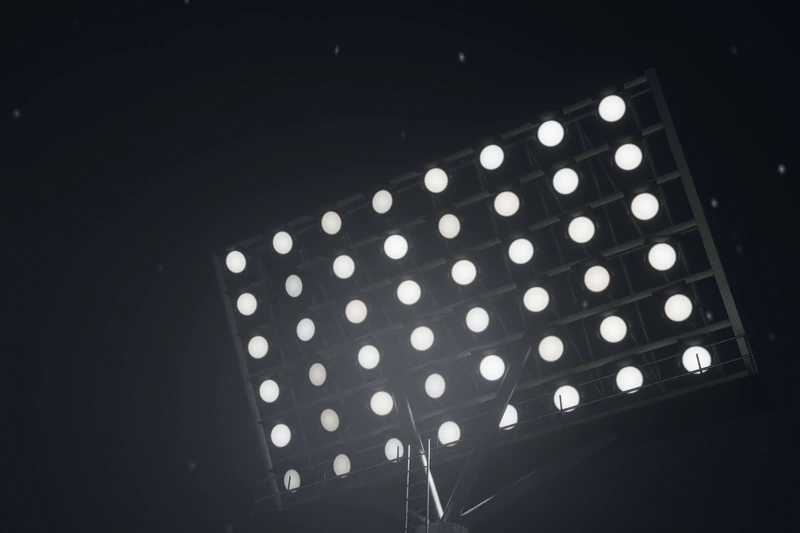 A floodlight bank against the night sky